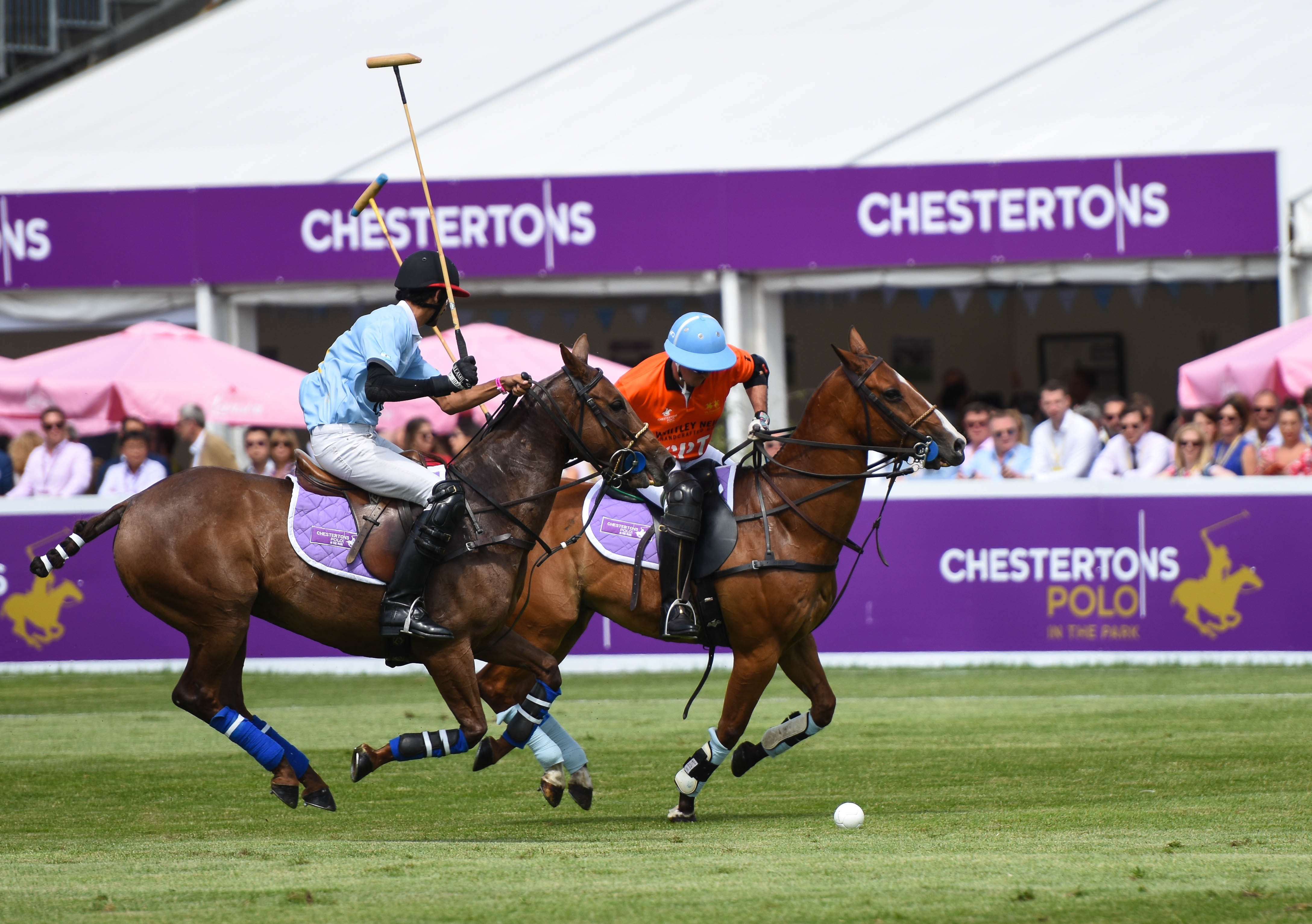 Polo players in action at Chestertons Polo in The Park.