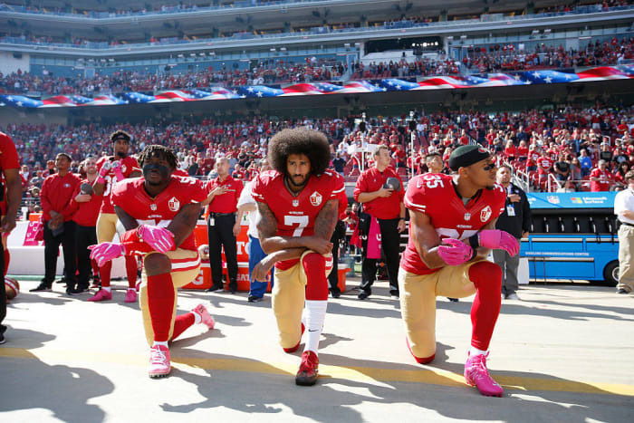 Colin Kaepernick takes a knee