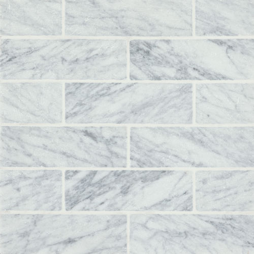 Suave Tumbled 4" X 12" Marble Tile in White Carrara