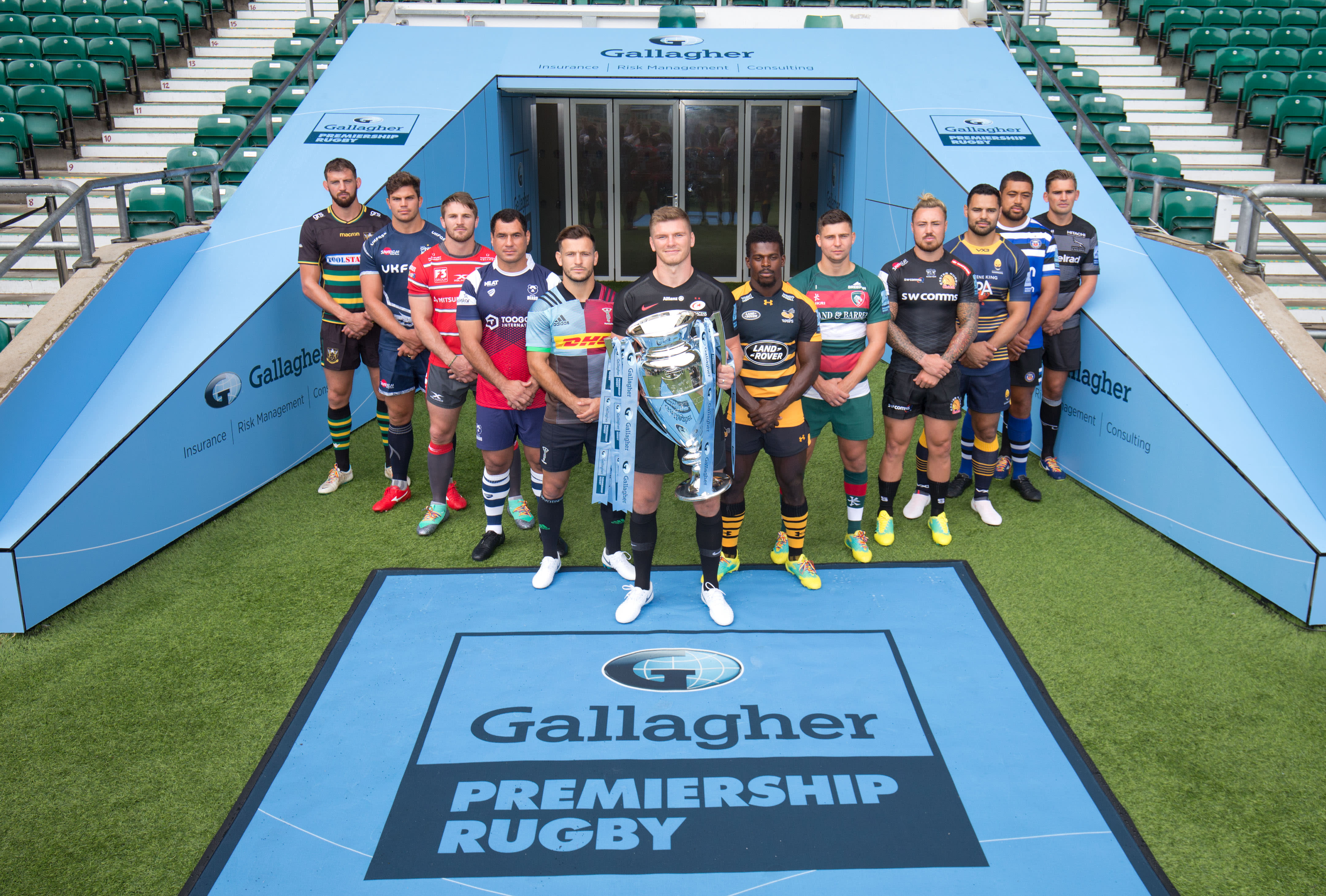 Gallagher Premiership rugby players pose with the trophy.