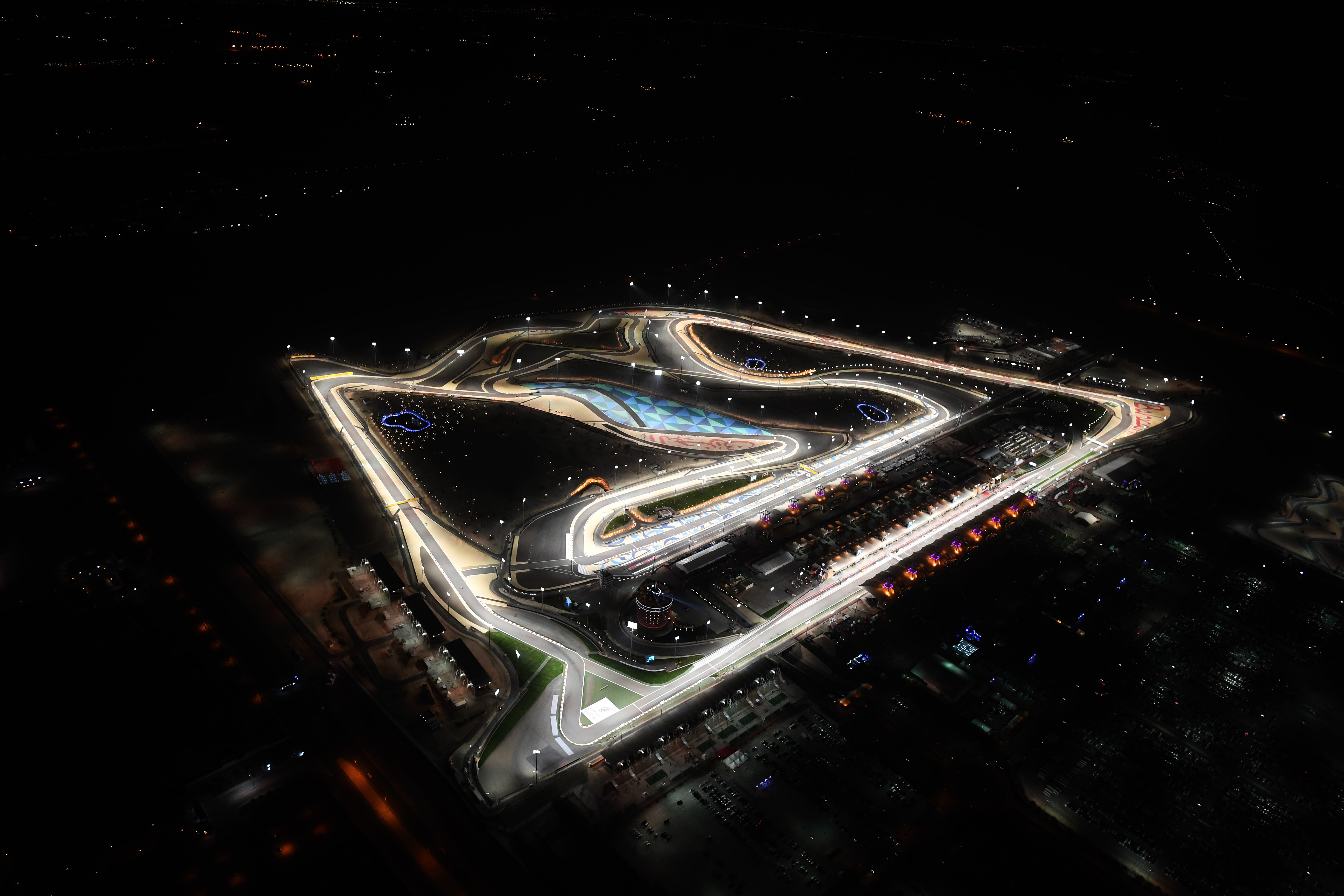 The Bahrain International Circuit illuminated at night by its floodlights