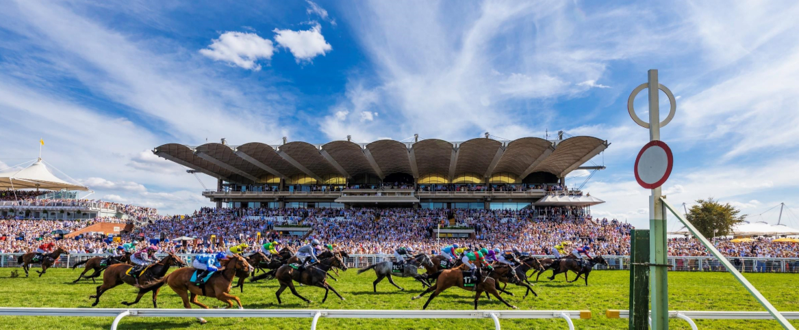 Horses cross the winners post at Qatar Goodwood Festival