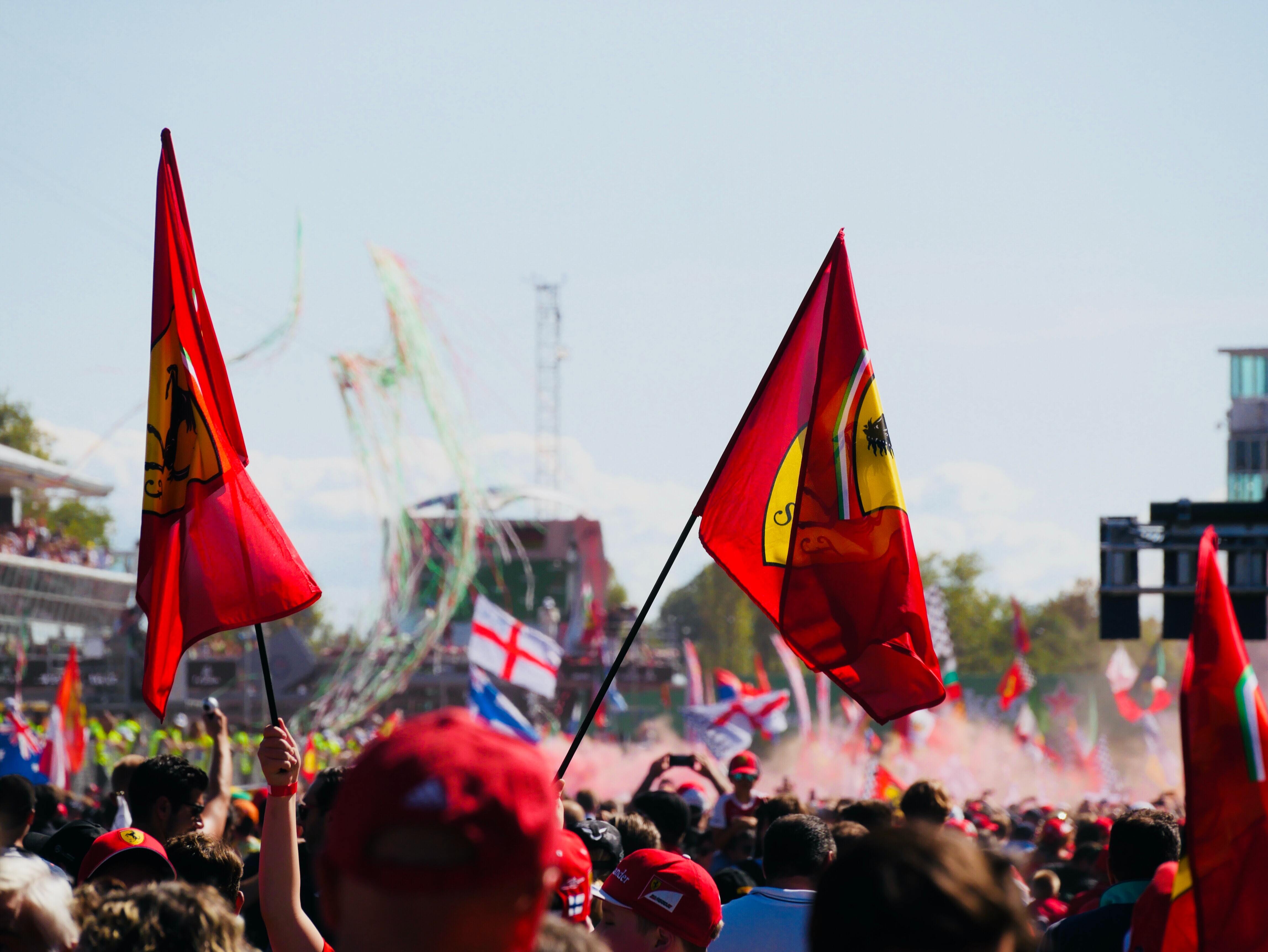 Ferrari fans look on at the podium celebrations at Monza