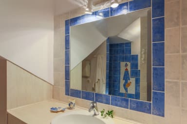 Broken tile mosaic as a detail from well designed bathroom 3