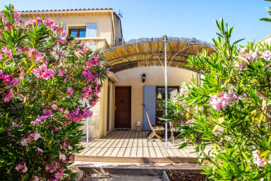 Covered terrace with wooden deck and dinning area 
