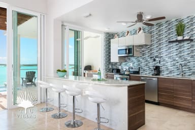 Prepare home made meals in your fully equipped kitchen with tropical views.