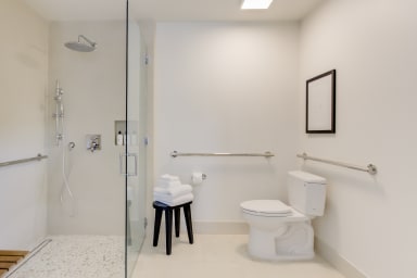 A private bath with a rain shower
