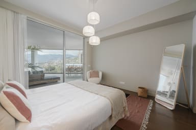 Bedroom with double bed and full body mirror