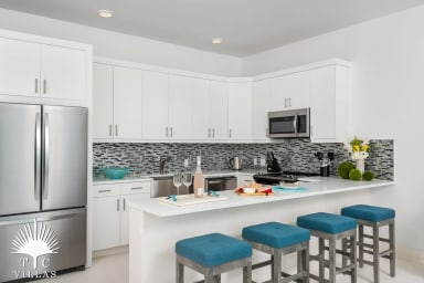 Villa Sandpiper's fully equipped kitchen with bar stools.