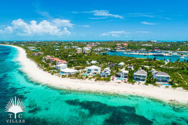 Aerial view of Grace Bay Beach, Villa Sandpiper, and Grace Bay Beach.
