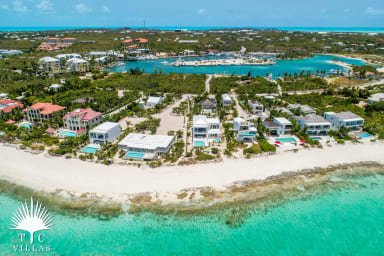 Bird's eye view of Grace Bay Beach, Villa Sandpebble, and Turtle Cove Marina.