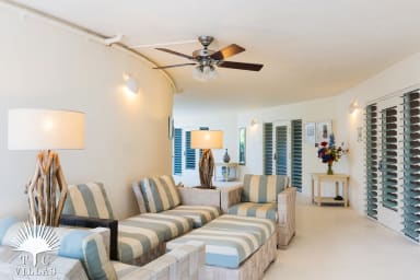 Turtle Beach Villa offers plentiful indoor seating for guests to enjoy.