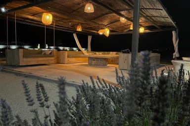The boules court and pergola by night