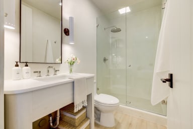 En-suite bathroom with rain shower and high-end toiletries
