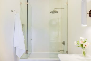 En-suite bathroom with rain shower and high-end toiletries