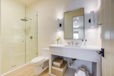 En-suite bathroom with rain shower and high-end toiletries