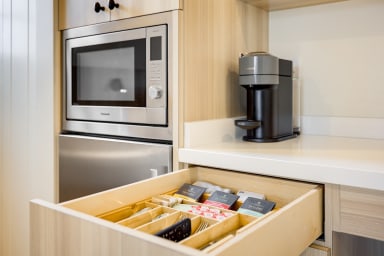 Essentials provided: Vertuo Coffe Pods, Tea, and bottle opener.