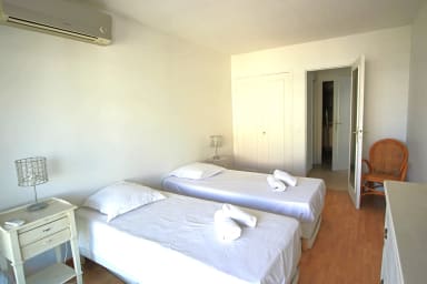first bedroom with 2 singles beds, open on small terrace