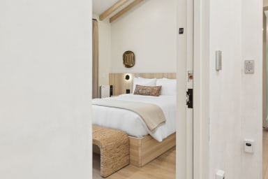 Queen-size bed, sleeps 2, seating area, and 65