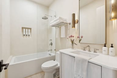 En-suite bathroom with rain shower and high-end toiletries