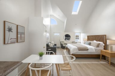 Cozy dining space with a 3-seater table just steps from the bedroom