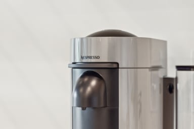 Nespresso, mini-fridge, microwave/air-fryer, plates/utensils. No stove.