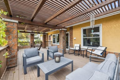 Front porch with outdoor seating and views!