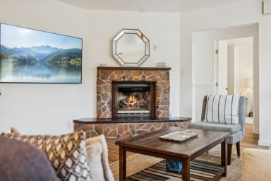 Living room with gas fireplace and smart TV