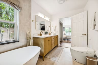 Fully renovated master bathroom with open shower and soaker tub!