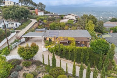 Aerial view of the home and mountain views