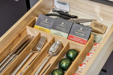 Essentials provided: Vertuo Coffe Pods, Tea, and bottle opener.