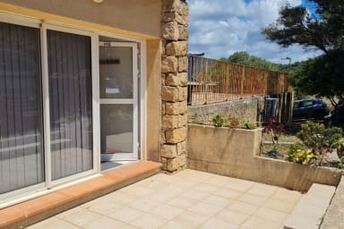 Terrace with furniture: table, chairs and parasol