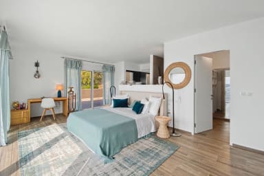 Bright, serene bedroom designed for rejuvenation with modern comforts provided.