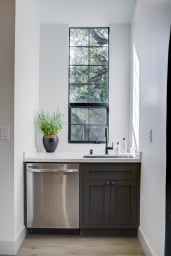 The kitchen has all stainless appliance