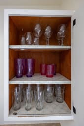 Well-prepared kitchen with wine glasses and cups for every occasion