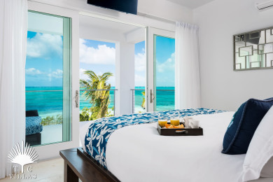 Sandcastle's master bedroom grants guests elevated views of Grace Bay. 