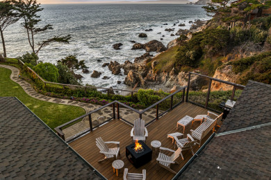 Expansive balcony - private backyard featuring a fire table and panoramic views