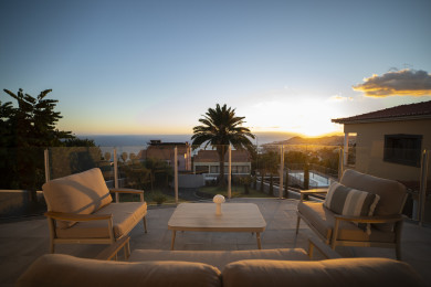Casa Mirante — Furnished terrace overlooking the bay at sunset, Madeira.