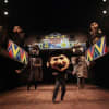Male ensemble and puppets - The Ragged Trousered Philanthropists, Isango Ensemble
