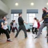 The Cyrano de Bergerac company in movement rehearsal