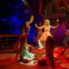 Carly Anderson as 'Kira' and the company