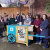 Julia Fawcett OBE, Janelle Brindle, Paul Dennett with young people from Liberty House