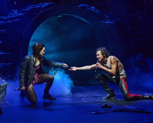 Katie Tonkinson as Raven and Glenn Adamson as Strat