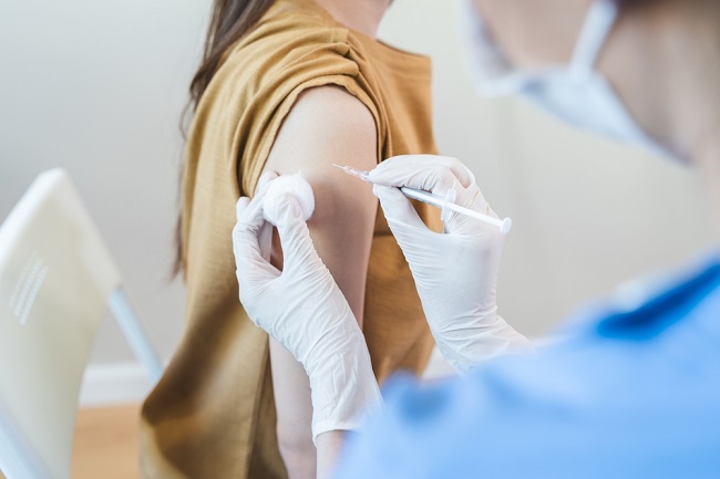 People,Getting,A,Vaccination,To,Prevent,Pandemic,Concept.,Woman,In