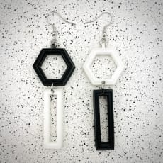 White / Black Mismatch Hexagon Earrings: Quirky mismatch design 3D printed in lightweight resin. More colours available.