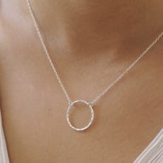 Hopea Open Hammered Circle Pendant Necklace: The Open Hammered Circle Pendant is the perfect addition to your everyday ethical outfit