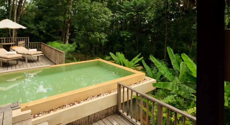 Deck chairs with view forest view at Six Senses Yao Noi in Koh Yao Noi, Thailand