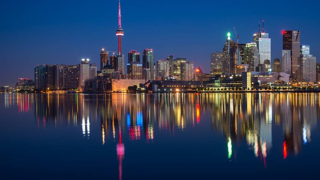 a body of water with a city in the background