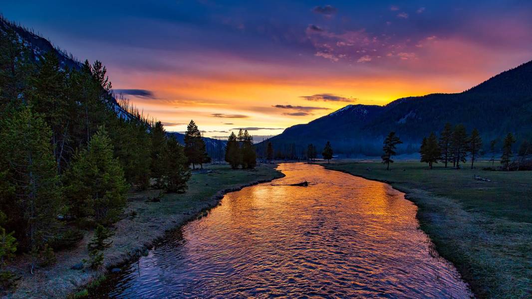 a sunset over a body of water