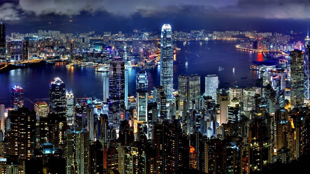 a large body of water with a city in the background